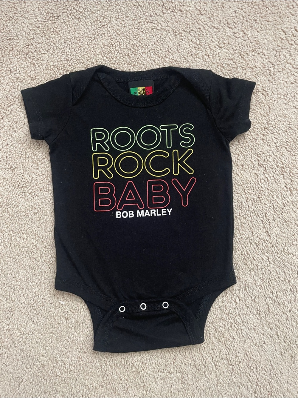Black Kids One-Piece Bodysuit with Colorful 'Roots Rock Baby' Graphic